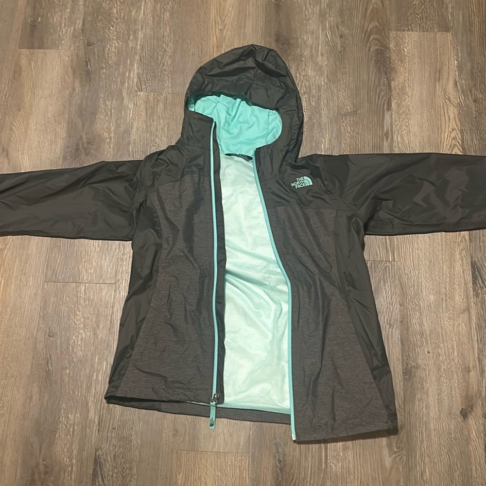 The North Face children’s large teal and dark grey windbreaker/raincoat